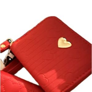 Red with gold heart pendant and gold,zipper an Gold heart keychain, coin, wallet